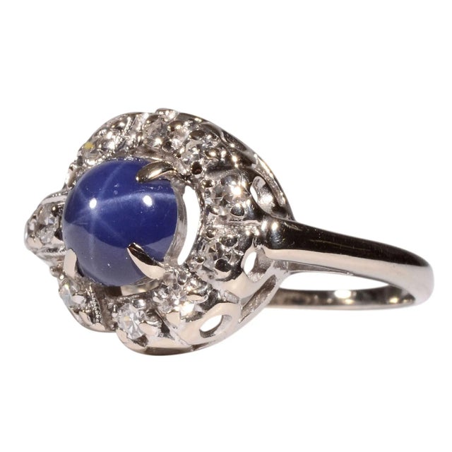 This is part of Chairish’s Fine Jewelry assortment. Estate synthetic star sapphire & diamond ring. This 14 karat white...