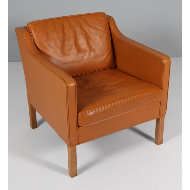 Børge Mogensen lounge chair original upholstered with cognac leather. Legs of oak. Model 2321, made by Fredericia...