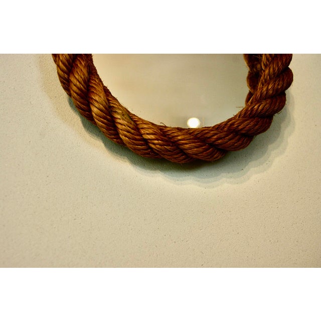 Small Audoux Minet rope mirror from 1960 with its braided rope back, good condition I have official proof of authenticity...