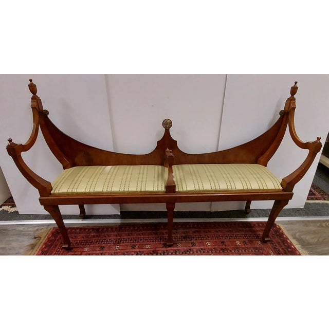 Old English hepplewhite style walnut courting bench is from around 1900. It has three medallions on the back, pictured....
