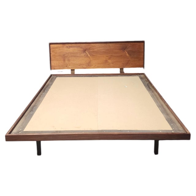 Minimalist full-size platform bed frame in richly figured teak, by Richard Artschwager. The design features a low-slung...