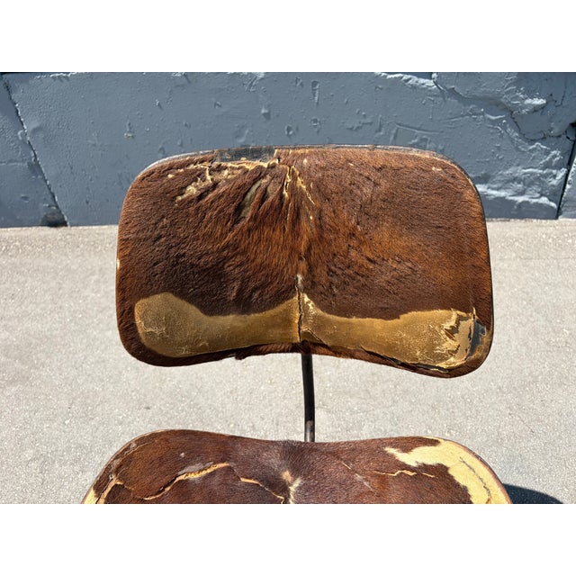 1950s Black Eames DCM Dining Chair with Original Hair on Hide Upholstery, Cowhide. Made by Herman Miller. Please see all...