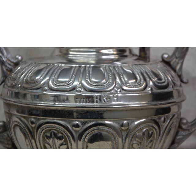 We are offering a classic Bradley and Hubbard lamp done in embossed brass with a nickel finish. The burner is dated 1888...