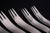 Arne Jacobsen for Anton Michelsen, set of six dinner forks. Set of six stainless steel dinner forks featuring Arne...