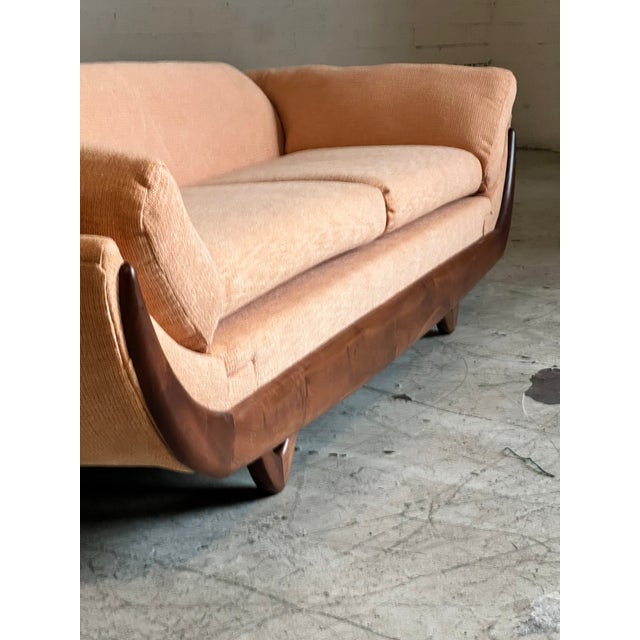 Beautifully refinished and reupholstered mid century modern sofa by Adrian Pearsall. Sculpted walnut base supports this...