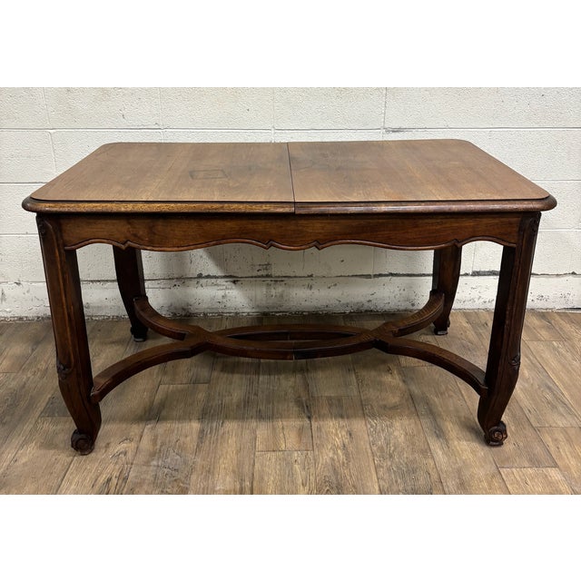 This is an absolutely gorgeous antique French Country Provincial or Louis XV style top draw leaf refectory extendable...