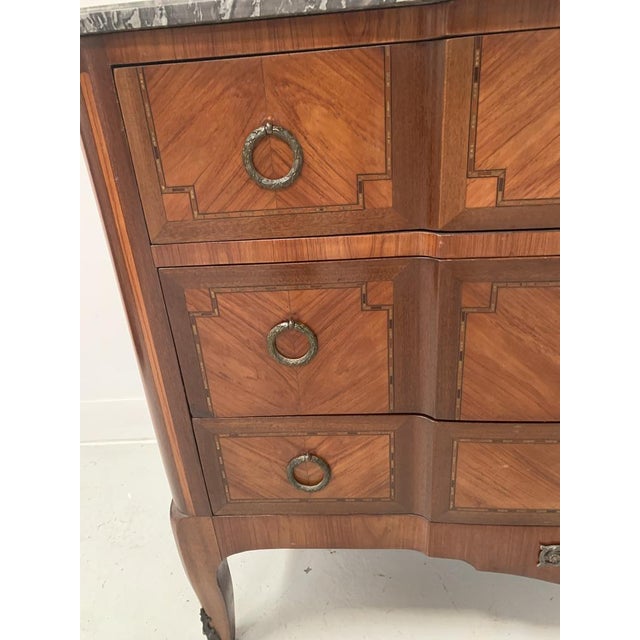 Transition style commode with projecting front, mahogany and rosewood veneer on an oak ground Three drawers in the front...