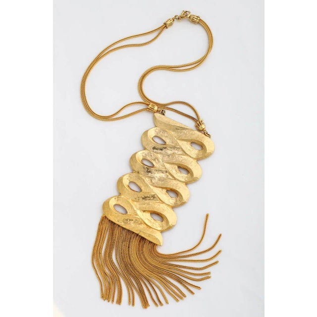 This is part of Chairish’s Costume Jewelry assortment. Two-tone gilt, signed Sandor scroll and fringe necklace. Chain is...