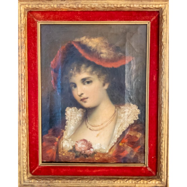 We are selling this simple traditional portrait painting of a lady. The lady is well dressed in red with a fancy red hat....