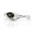 Exude sophisticated, dramatic charm with this sleekly swooping silhouette, holding a rich, earthy gem paired against a...