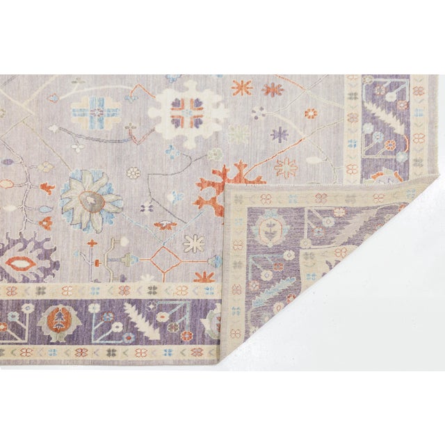 Elevate your space with this beautiful Modern Oushak style rug, hand-knotted from high-pile wool. It features a...