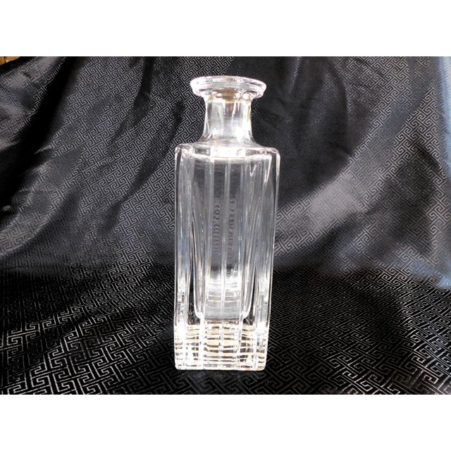 This is a rectangular shaped liquor decanter with verical cuts and a large solid crystal base. I have not yet found any...