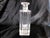 This is a rectangular shaped liquor decanter with verical cuts and a large solid crystal base. I have not yet found any...
