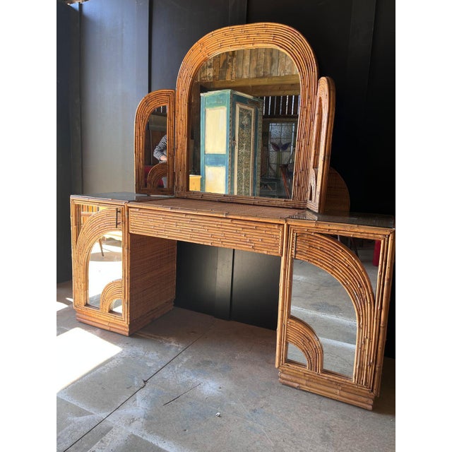 Vintage bamboo dressing table with 2 side cupboards with shelving and brass handles and central drawer The mirror has 2...