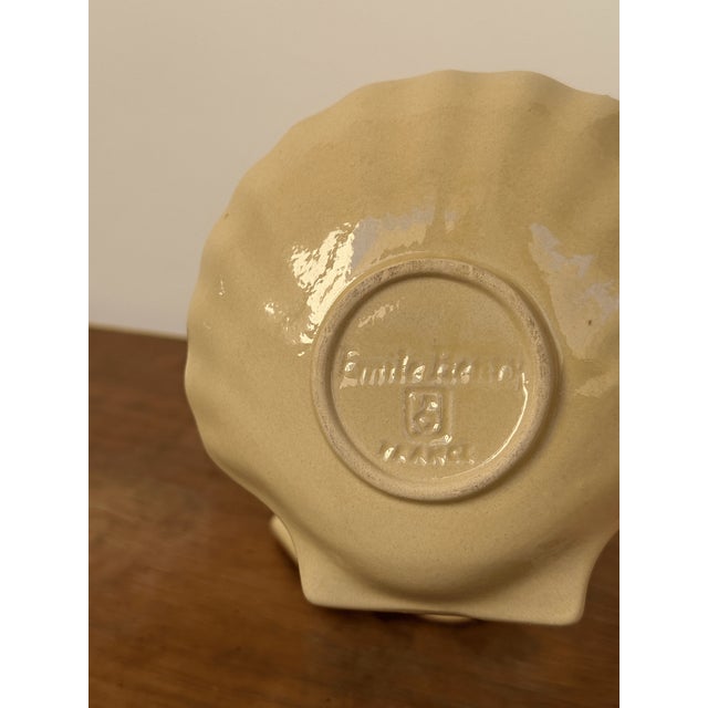 Small scallop shaped ceramic plates.