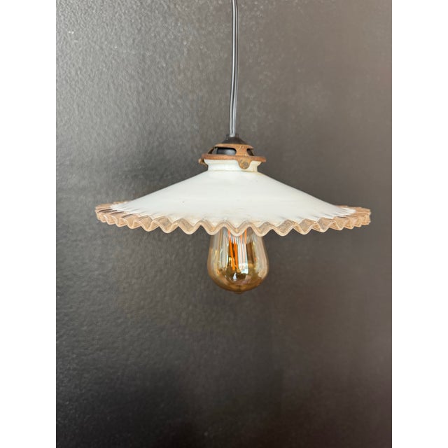 These early 20th century French opaline glass pendant shades are beautiful examples of hand-blown European lighting,...