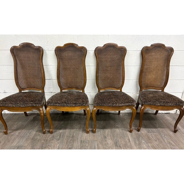 This is a gorgeous set of 4 vintage French Provincial Louis XV style dining chairs featuring tall shaped cane backs,...