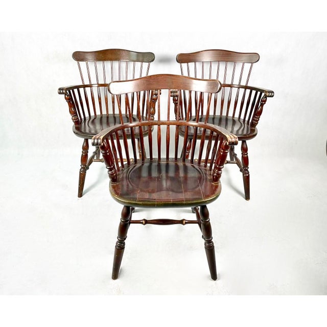 A set of three chairs from the 1960s from Inited Kingdom. The chairs are made entirely of solid beech wood. The patina is...
