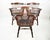 A set of three chairs from the 1960s from Inited Kingdom. The chairs are made entirely of solid beech wood. The patina is...