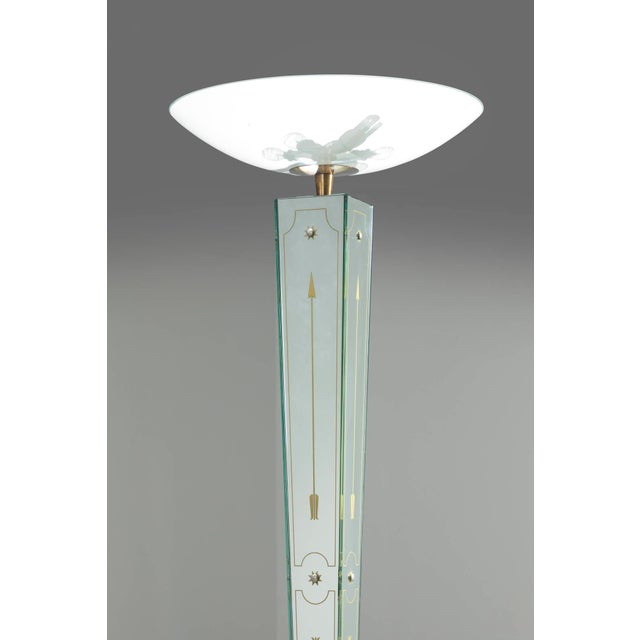 This elegant floor lamp is made of a mirrored glass body, it reflects the light in a charming way, creating a warm and...