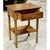 This piece features a classic colonial silhouette with turned legs and a warm, polished wood finish. The single drawer is...