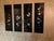 Set of four (4) handmade vintage Oriental-themed black lacquer wall art panels featuring intricate designs and...