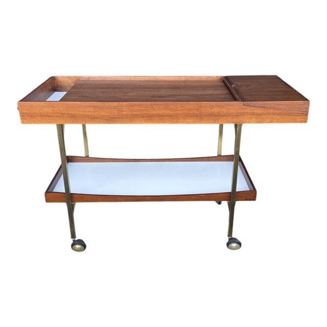 This elegant mid-century style bar cart has been fully restored by our professional craftsmen and newly finished to...