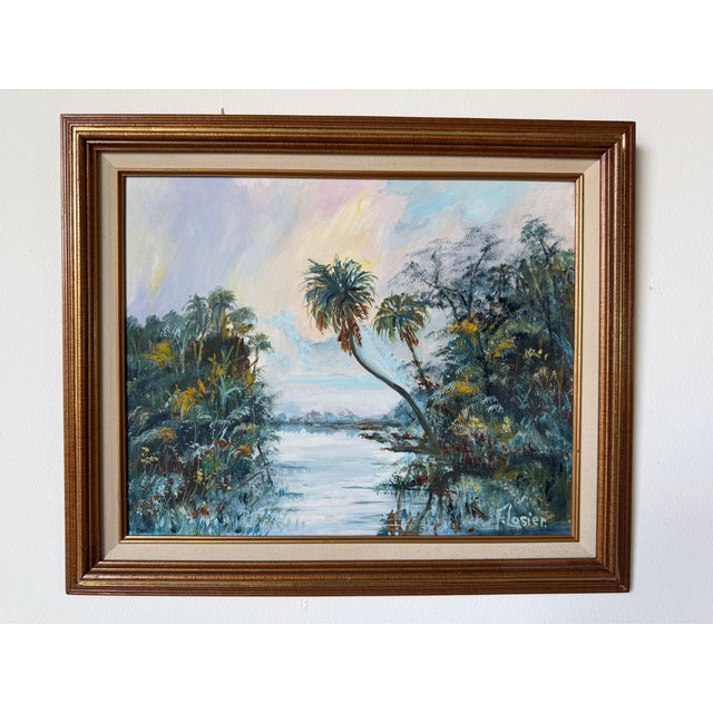 Beautiful vintage tropical oil painting, signed W. Flosier. Painted on Masonite board, the scene depicts a serene Florida...
