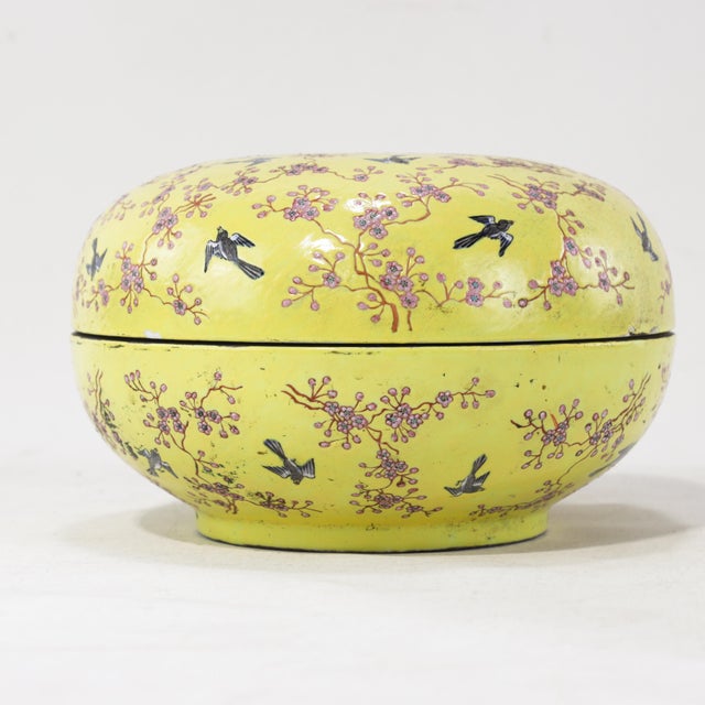 This exquisite large porcelain covered box features a vibrant yellow-ground finish, a color traditionally associated with...