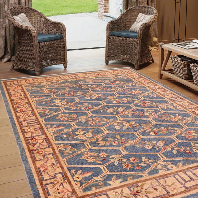 "Enhance the ambiance of your home with this magnificent Persian-influenced Turkish hand-knotted rug made by skilled...
