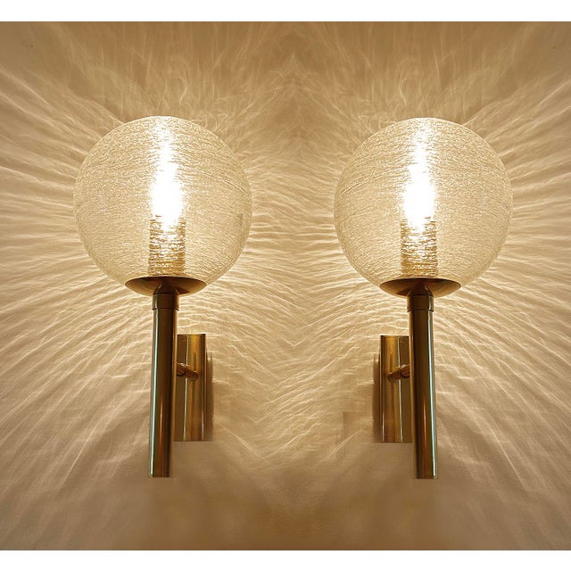 Pair of Vintage sconces by Doria , brass structure with structured whirlwind surface glass globes shades Dimensions :...
