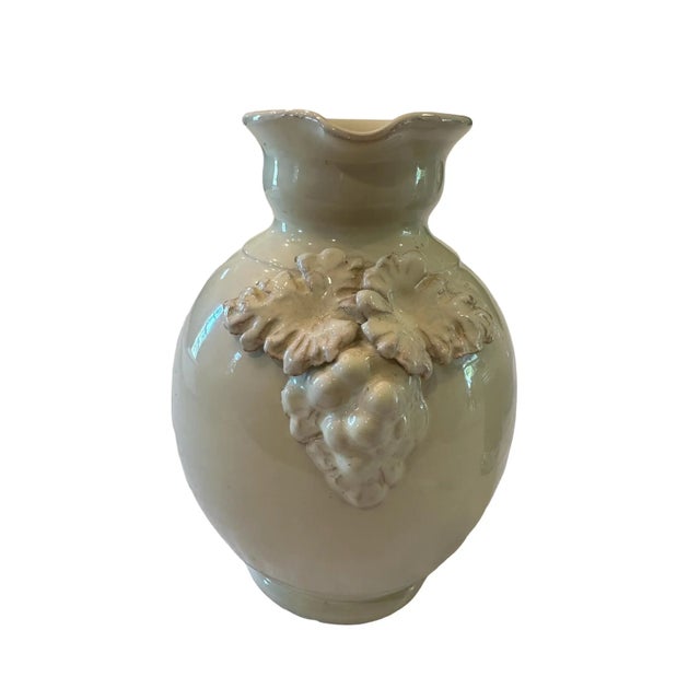 Beautiful cream colored water pitcher with a raised Italian grape design. An elegant piece perfect for everyday use,...