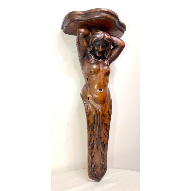 Up for sale is a large antique hand-carved oak sculpture of a nude woman, designed as a wall shelf. The sculpture features...