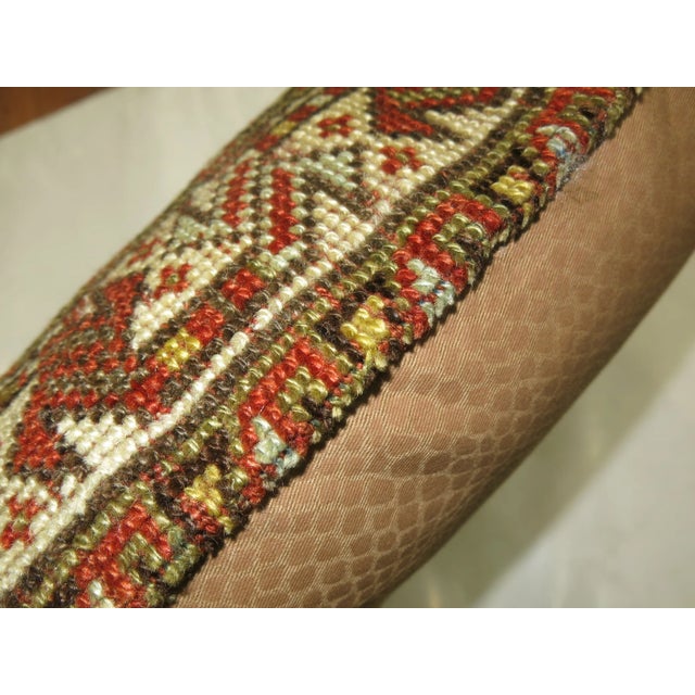 Pillow made from a Vintage tribal persian rug with cotton back. Zipper closure and foam insert provided. 16'' x 23''