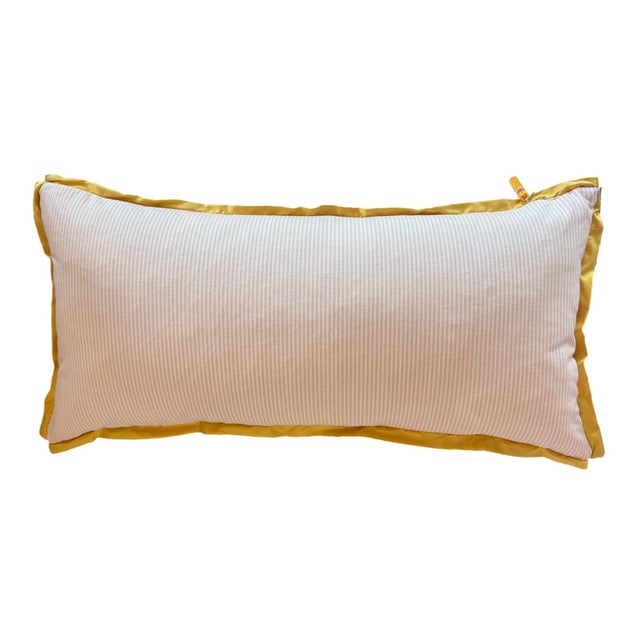 This lumbar pillow features soft pink pinstripes, golden floral embroidery, and a golden welt. A charming piece that...
