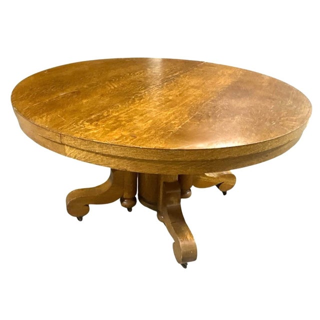 Antique Quarter Sawn Oak Round Dining Table 54" Diameter - Circa 1910. It pulls apart in the center to hold leaves. The...
