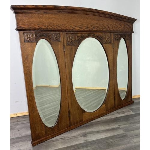 Antique French Oak Wall Mirror This striking antique French oak wall mirror features a classic triple-panel design with...