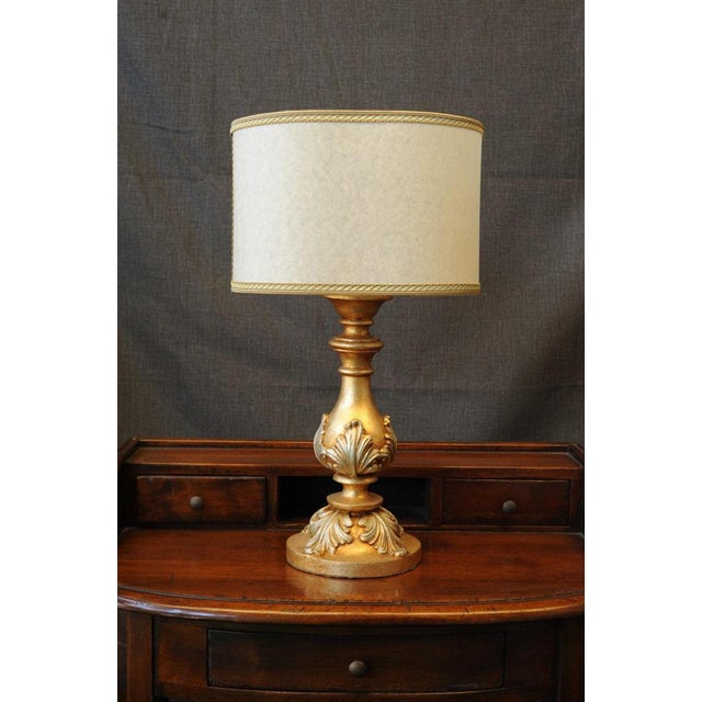 Gold Square Lamp. A fine lamp with a classic, linear style, crafted by Florentine artisans. The entirely wooden pedestal...