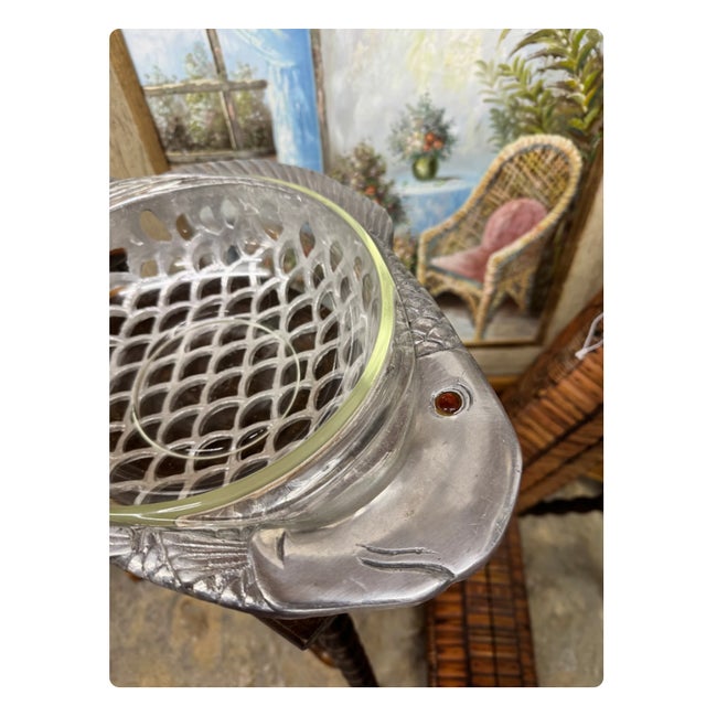 A sculptural 1981 Arthur Court fish bowl, combining functional serveware with the whimsical, nature-inspired design...