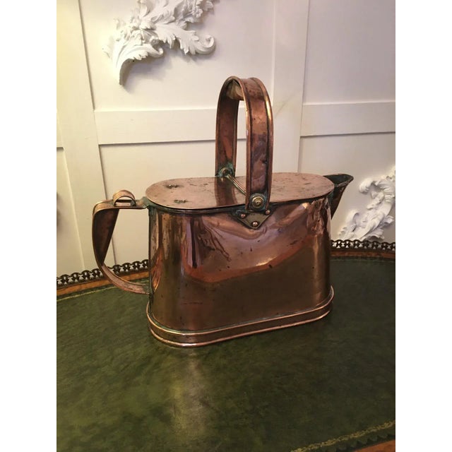 Quality antique Victorian copper watering can having a shaped swing handle with lift up lids, shaped spout and a lovely...