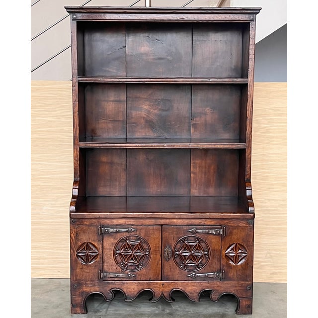 Early 19th century Rustic Spanish open bookcase is a relic from the distant past, ready to serve your family for...