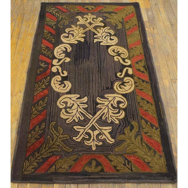 American Hooked rug. Measures: 2'8" x 4'8". Small Scatter Size American Hooked 1930s Antique Wool Rug, Country of Origin:...