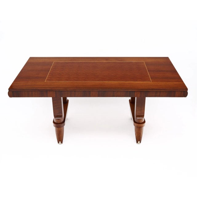 Dining table from the mid-century period in France made with a beautiful rosewood diamond parquetry top and lemon wood...