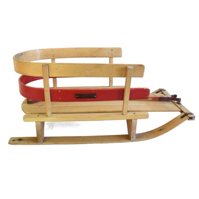 Midcentury children's snow sled with swinging pull handle. Marked with a wood plate on the side "Cobobb In." The pull...