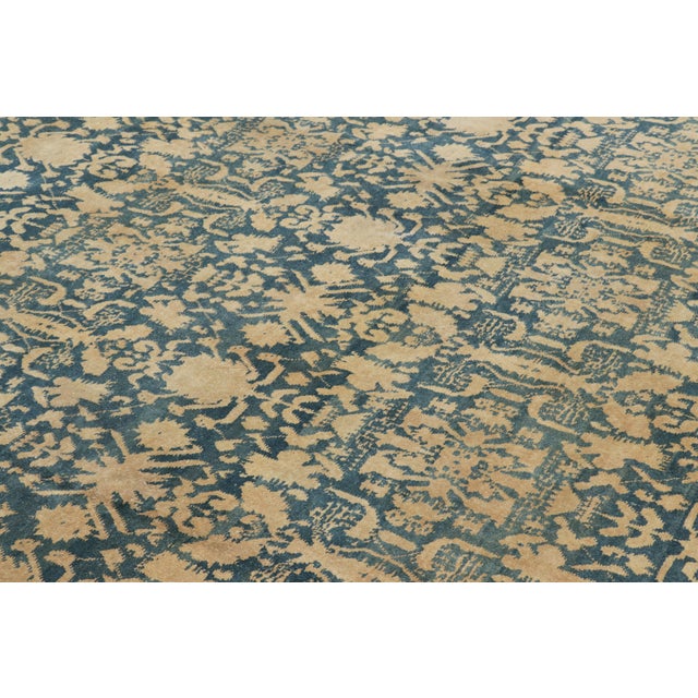 Made with hand-knotted wool in India, this 12x13 antique Agra rug is an extremely rare and exciting new oversized addition...