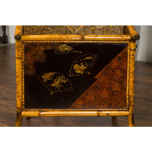 An English bamboo Canterbury from the early 19th century, with embossed leather and Chinoiserie motifs. Born in England at...