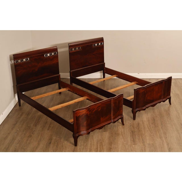 Elegant Pair of Vintage Twin Beds Crafted in Rich Mahogany Veneer, Featuring Shaped Headboards with Decorative Pierced...