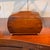 A tea caddy of sarcophagus form with bowed sides and a stepped pyramidal lid, banded throughout in fine light stringing...