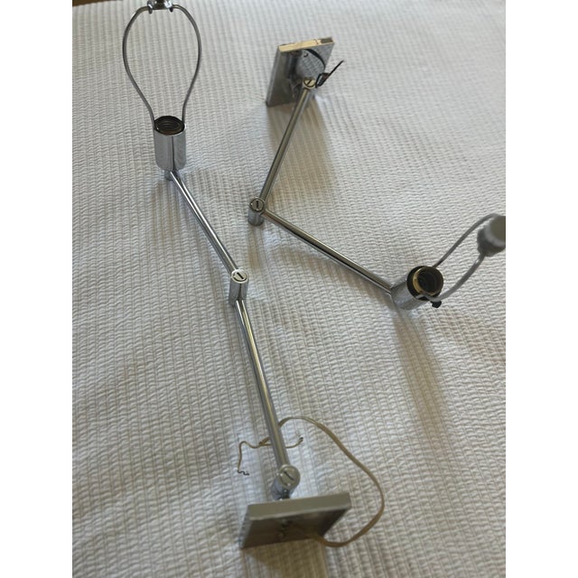 These are 2 vintage shiny chrome vintage wall fixtures