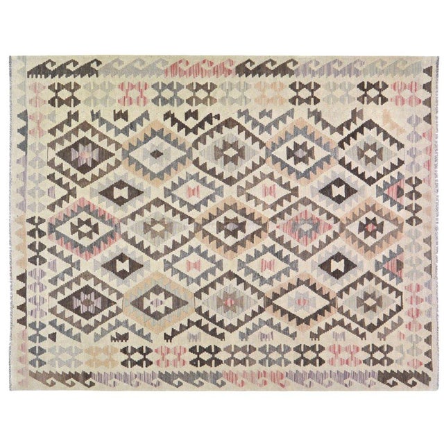 Flatweaved with care using traditional rug-making techniques, this wool rug blends timeless craftsmanship with a modern...
